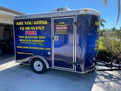 An enclosed trailer which reads, "Are you going to heaven?"